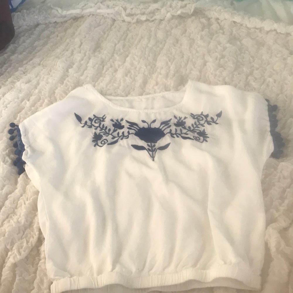 White and blue detailed blouse with pom poms